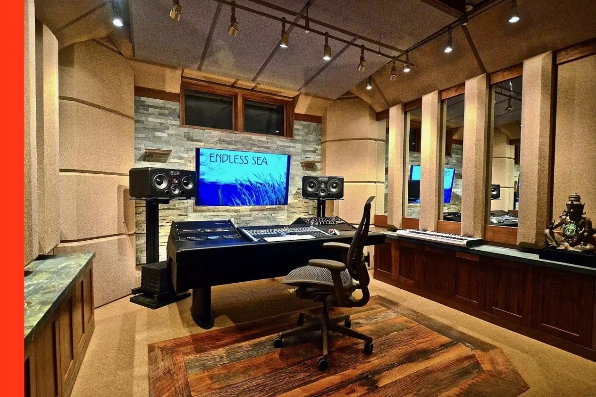Clean music studio with a mounted monitor